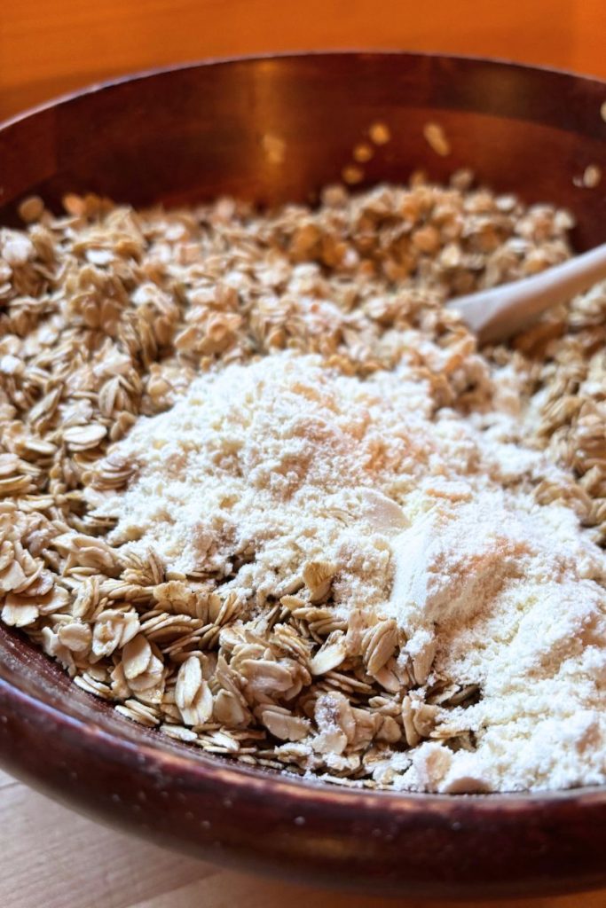 Granola with protein powder being mixed in