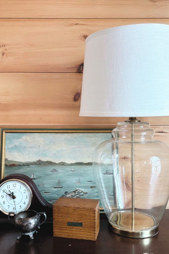 Large lamp, mantle clock, painting, recipe box and pewter dish collected together